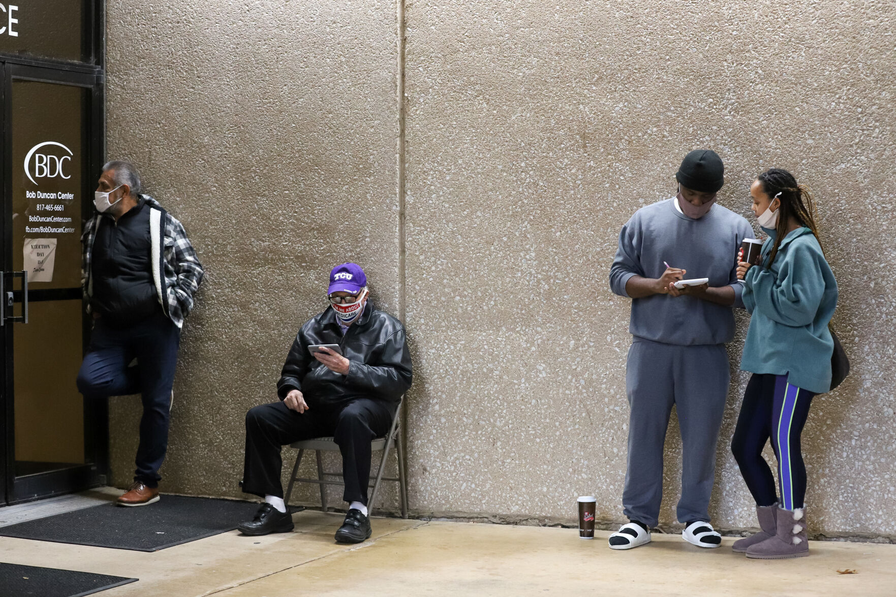 Photos: Metroplex voters brave cold weather at the polls, businesses board windows on Election Day